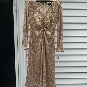 For sale Maggy London Rose Gold midi dress Size 10. Never worn tags still on.